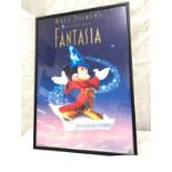 Framed walt disney poster frame measures approximately 24 inches by 17.5 inches