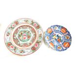 Two hand painted oriental plates both with marks to base largest measures 10 inches diameter