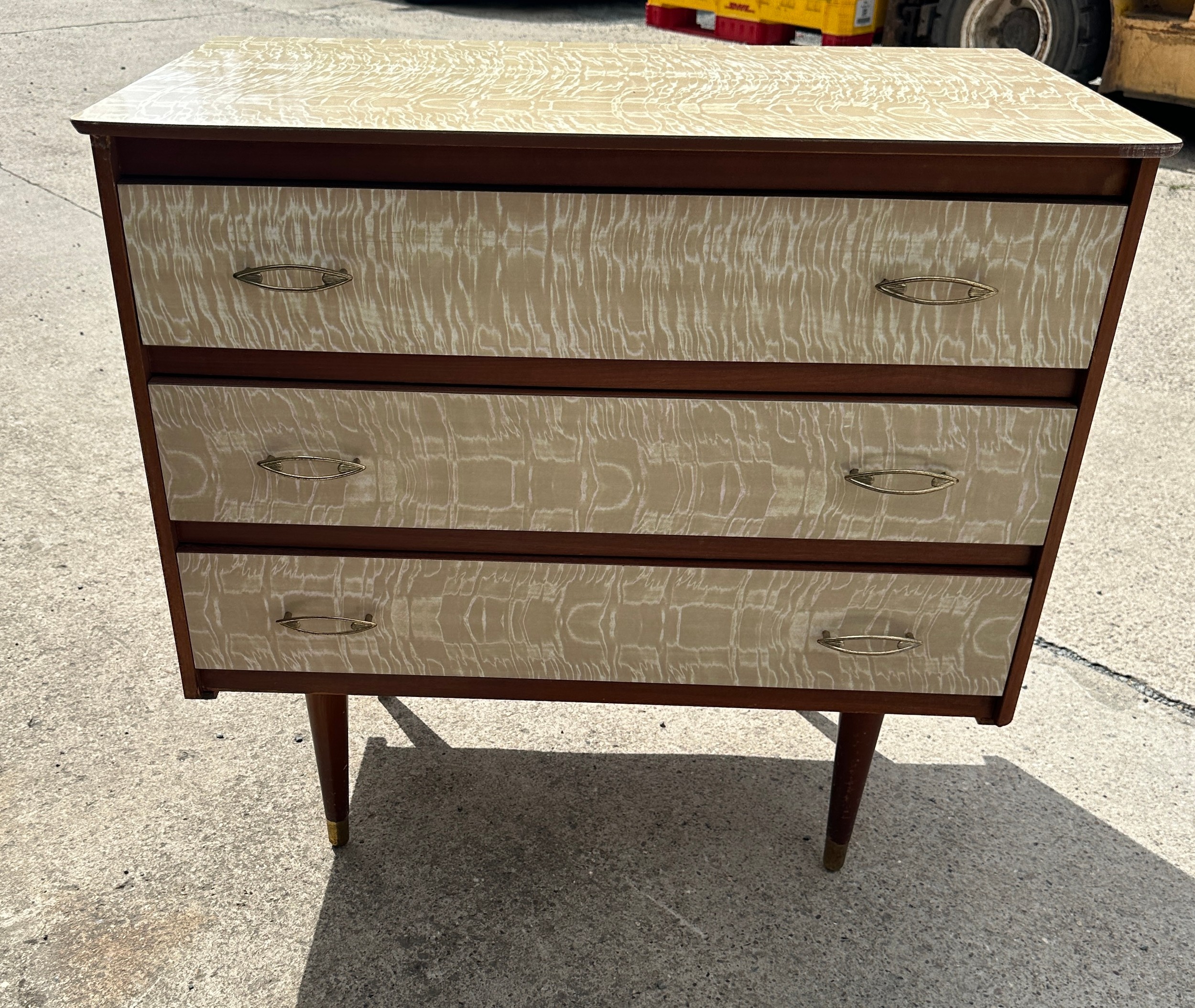 60's melamine three drawer chest of drawers measures approx 30 inches wide by 28 inches tall