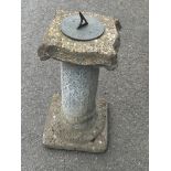 Concrete sun dial measures 25 inches tall