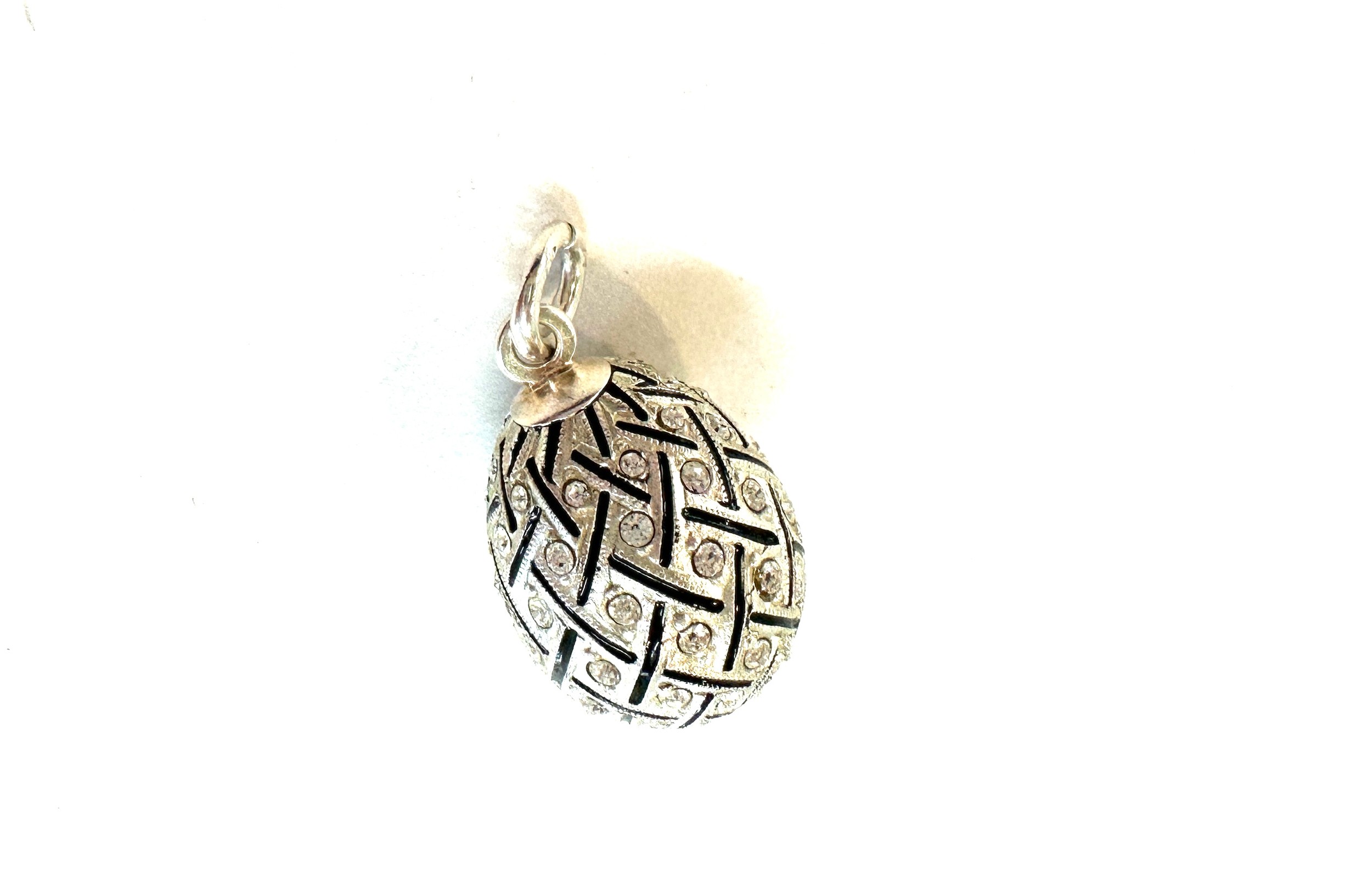 White metal enamel and paste set egg pendant charm. indistinct marks length 2cm