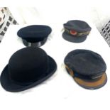 Selection of four vintage hats includes LMS hat, Dunn and co bowler hat etc
