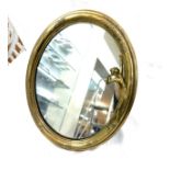 Art deco style brass framed oval mirror measures approx 14 inches tall