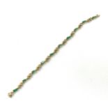 18ct Gold diamond and emerald bracelet, hallmarked, total weight 7.7grams 17cm length