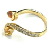 Ladies 18ct gold diamond and citrine dress ring, set with 19 small brilliant cut diamonds, total