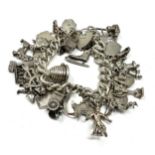 A Vintage Silver Charm Bracelet With Assorted Charms (112g)