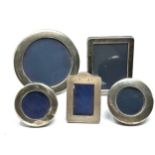 5 small silver picture frames largest measures approx 11cm dia