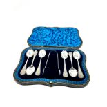 Boxed set of silver tea spoons & sugar tongs