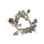 Ladies silver charm bracelet and charms, total weight 80grams