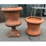 Two terracotta embossed urns one with stand one without largest measures approx 20 inches tall 14