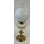 Vintage brass base oil lamp with funnel and shade, shade has a crack