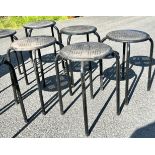 7 small metal stacking stools, approximate height 18 inches