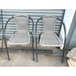 2 modern metal and wicker stacking garden chairs