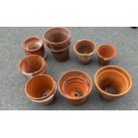 Selection of various sized terracotta plant pots approx 13 largest measures approx 9 inches tall