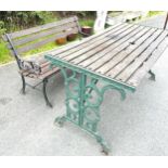 Cast iron table, and bench, approximate measures of table: Width 56 inches, Height 26 inches,