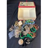 Selection of vintage and later costume jewellery includes brooches, beads etc
