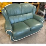 2 Seater green leather sofa, approximate measurements: Height 35 inches, Depth 23 inches, Width 55