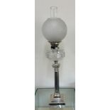 Silver plated column base oil lamp height approximately 30 inches, complete with funnel and shade