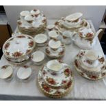 Large selection of Royal Albert Country Rose part dinner and tea services to include cups,