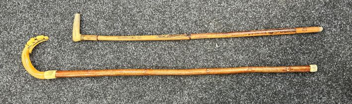 Two antique horn handled walking sticks largest measures approx 41 inches long