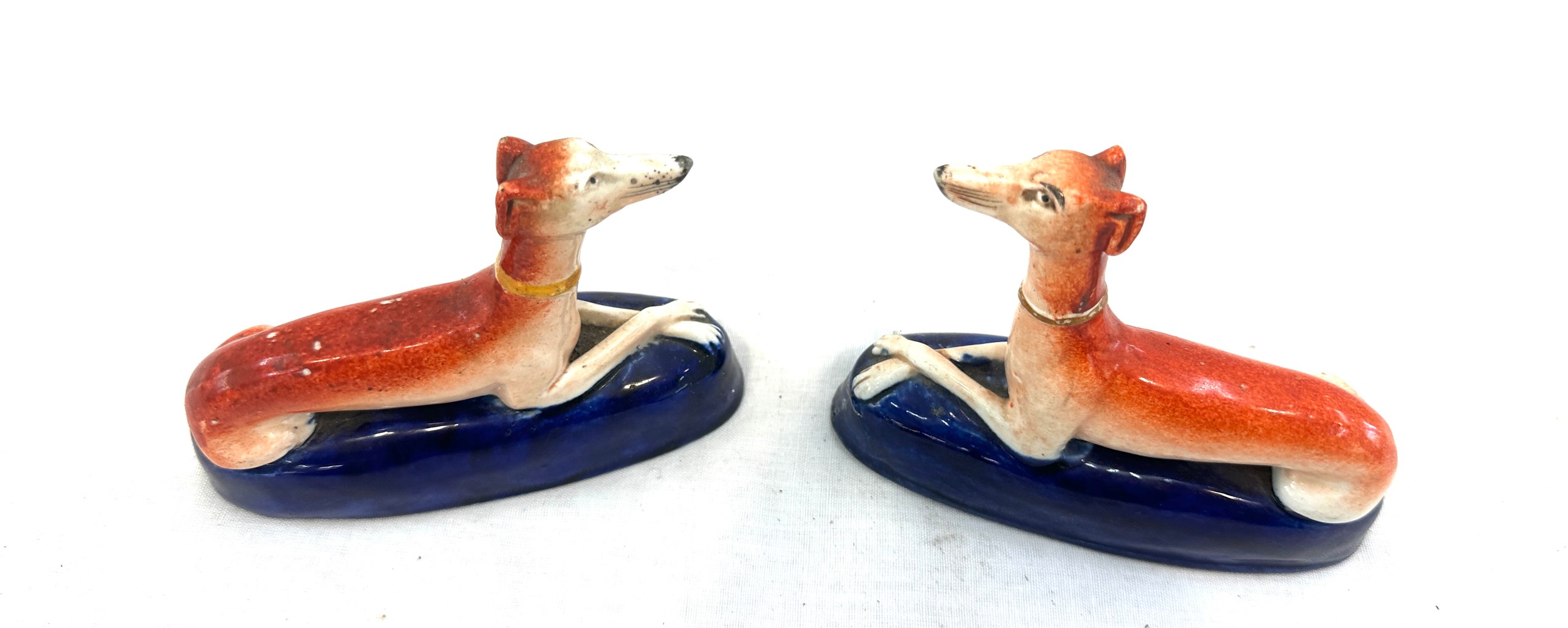 Pair of antique Staffordshire hand painted miniature dog figures measures approx 4.5 inches wide