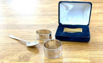 Three silver hallmarked items two napkin rings and a spoon