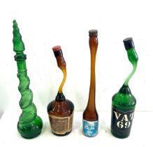 Selection of vintage novelty bottles includes tia maria etc tallest measures approximately 17 inches