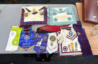 Selection of vintage masonic jewels and aprons