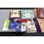 Selection of vintage masonic jewels and aprons