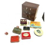 Selection of vintage tins and a storage cabinet