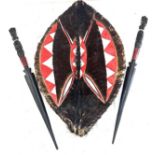 African shield and 2 wooden carved swords, shield measures approximately 24 inches by 15 inches