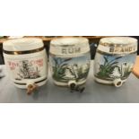 Three vintage porcelain hand painted Brandy, Rum and Wine barrels- damage to rum barrel. Measures