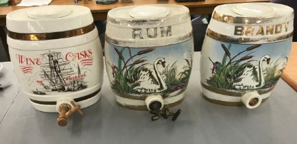 Three vintage porcelain hand painted Brandy, Rum and Wine barrels- damage to rum barrel. Measures