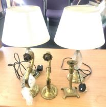 Selection of brass items to include a pair of lamps, pair of wall lights and a candle stick