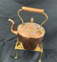 Copper kettle on stand, height of kettle approximately 10 inches