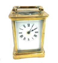 Vintage miniature carriage clock with key measures approx 4.5 inches tall