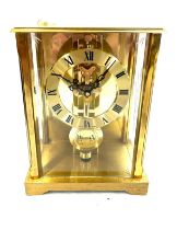 Vintage brass mantel clock signed S.Haller Germany measures approx 8 inches tall by 5.5 inches wide