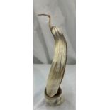 Carved horn figure of a pelican, approximate height 13.5 inches