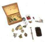 Box of collectable items to include cap badges etc
