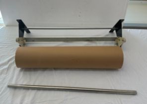 Wall hanging paper dispenser with large brown roll, length of brown roll 24 inches