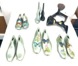 Selection of vintage hand painted metal shoe lasts and one other