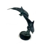Metal dolphin sculpture on a wooden plinth 15 inches tall
