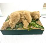 A Micheal Tallis creation of an automated moving sleeping bear. Measures approx 11 inches tall by 24