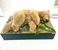 A Micheal Tallis creation of an automated moving sleeping bear. Measures approx 11 inches tall by 24