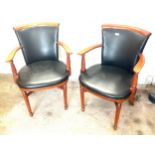 Pair of faux leather and wood office chairs