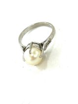 Art Deco antique pearl and diamond set ring, mount tests as palladium, approximate weight 3.2g
