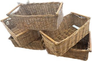 Selection of 5 matching wicker baskets measures approx 25 inches long by 14 inches wide