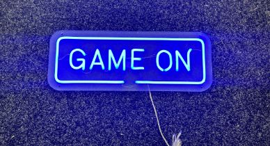 Neon beach light up game on blue neon light, complete working order measures approximately 20 inches