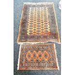 Two vintage patterned rugs largest measures approx 26 inches long by 51 inches wide