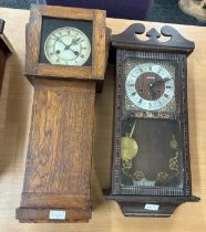 Two vintage wall hanging clocks both two key hole- untested without key or pendulum Largest measures